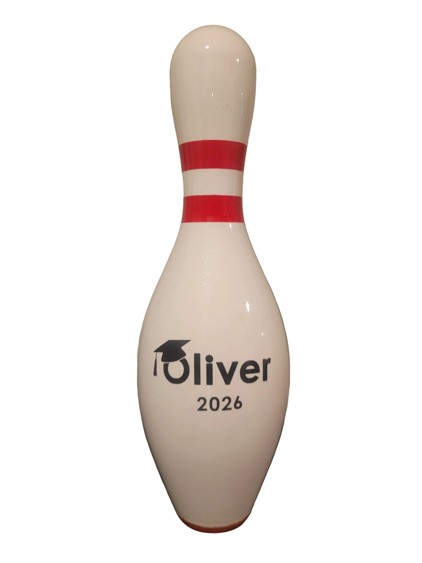 A custom white bowling personalized with a graduation cap.