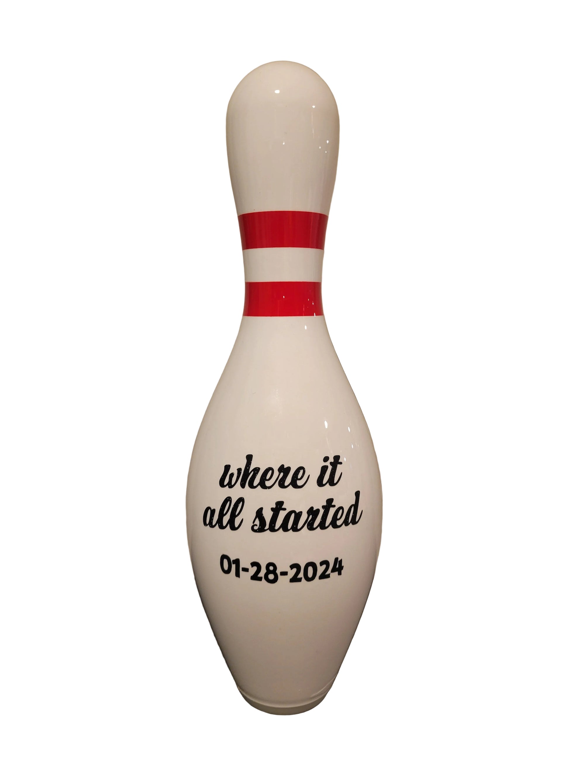 A white bowling pin with black printed text reading 'where it all started 01-28-2024'.