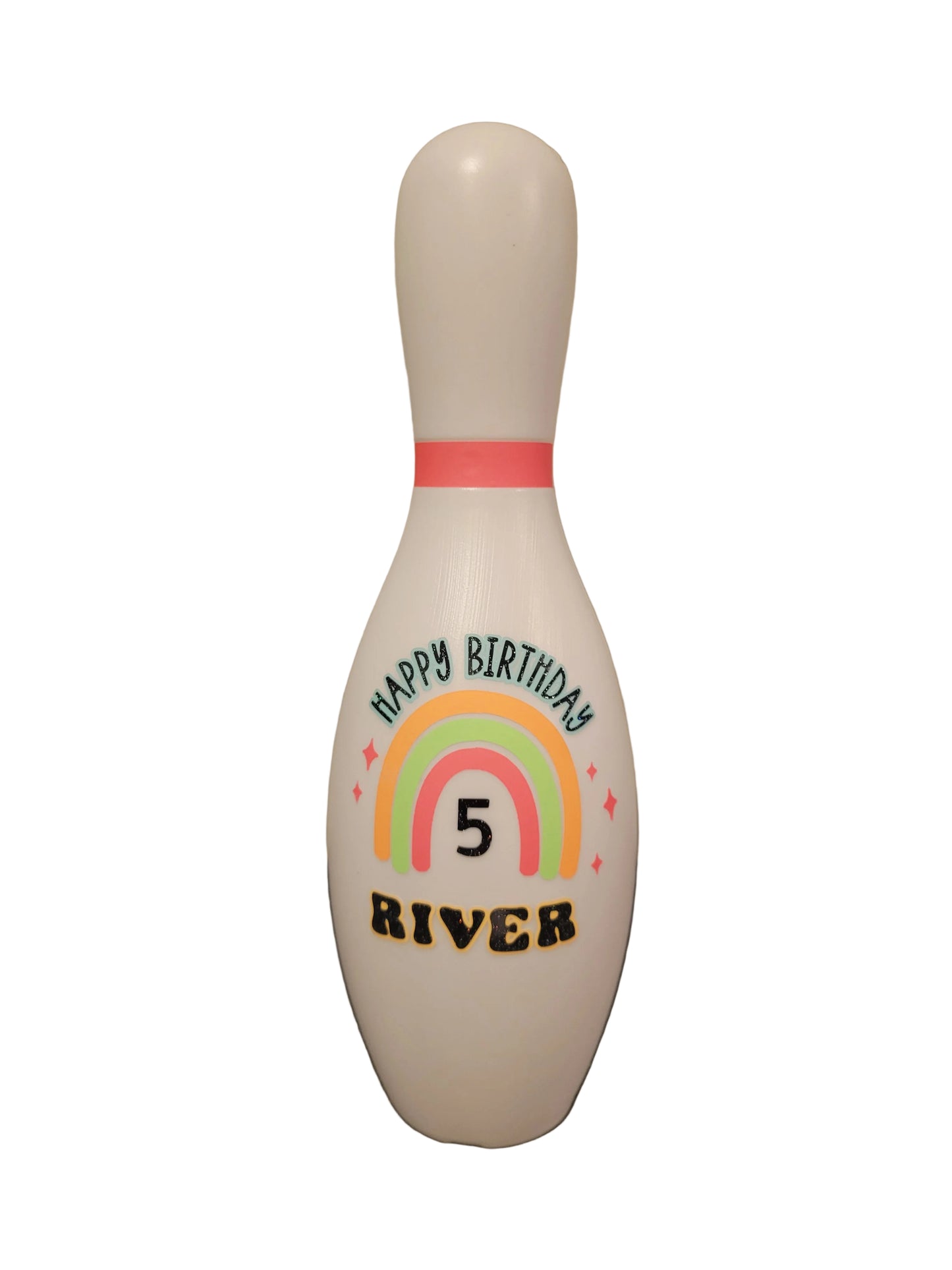 A custom birthday bowling pin with a rainbow theme